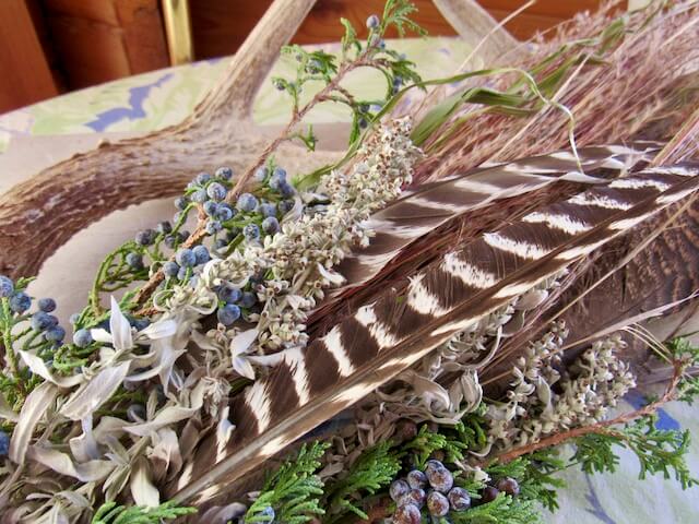 Turkey feather, antler, sage and cedar